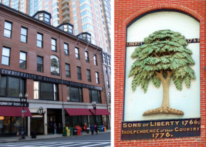 Image of red brick, four story building. Plaque showing engraved green tree representing the liberty tree.