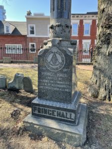 Cemetery marker for Prince Hall. It is a large granite monument with text engravings.