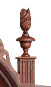a close up photograph of detail on a carved wooden chair