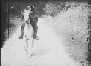A still from The Midnight Ride of Paul Revere. Paul Revere is riding a horse towards the camera.
