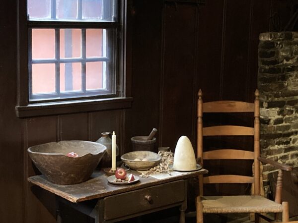 A photograph of the kitchen of the Revere House showing a mixing bowl, holiday foods and a sugar loaf