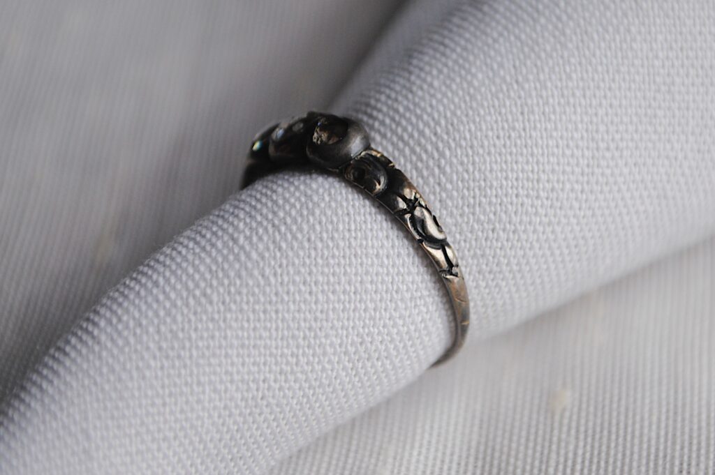 detail of the engravings on rachel revere's ring