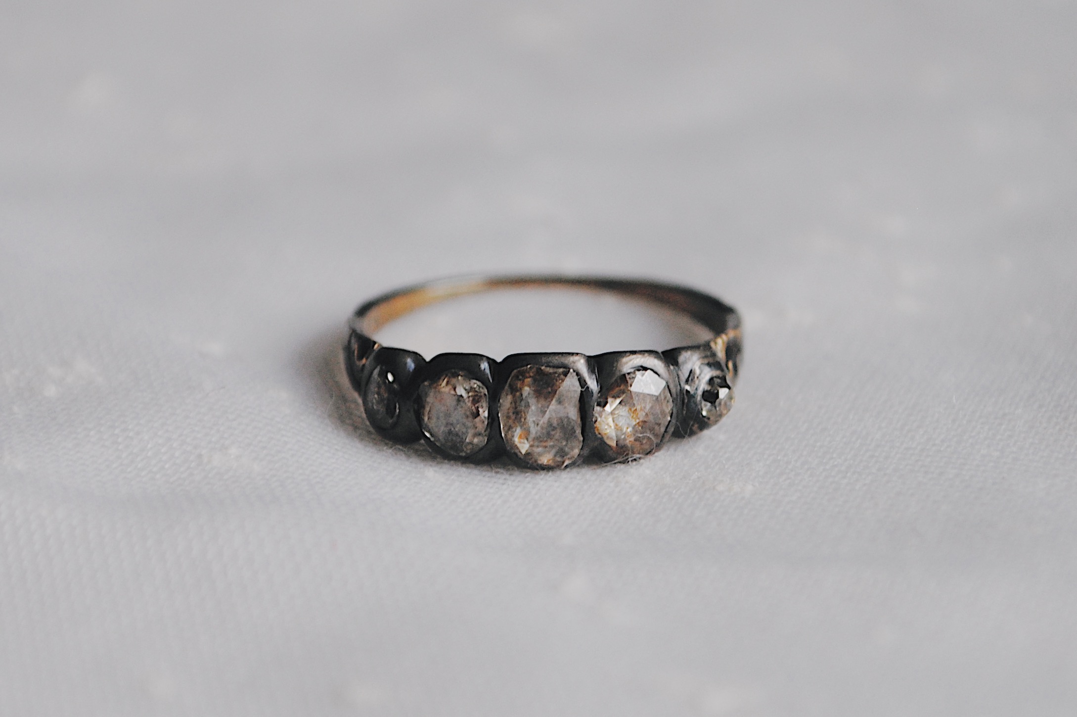 rachel revere's ring on a white tablecloth