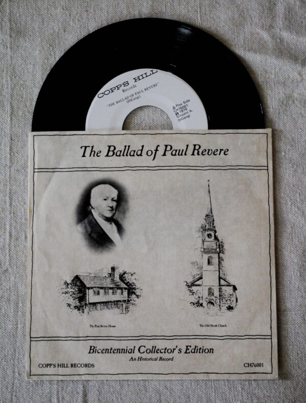 A vinyl record that says the name of the singer (Vincent DiGangi) and the year recorded (1976). There is also a paper case depicting a black and white image of Paul Revere, The Paul Revere House, and The Old North Church.